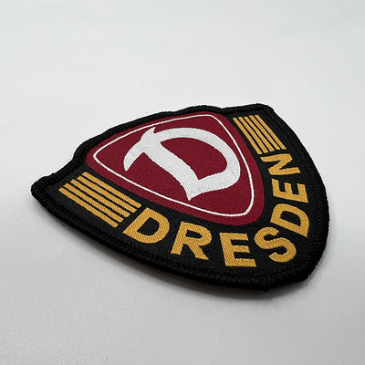 La marca su ordinazione Logo Woven Washable Iron On rattoppa i distintivi della spalla del confine di Merrowed