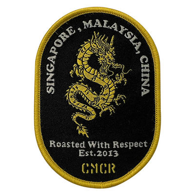 Confine adesivo su misura di Dragon Embroidery Patches Shrink Proof Merrow della colata