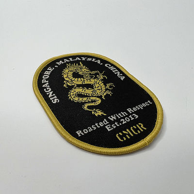 Confine adesivo su misura di Dragon Embroidery Patches Shrink Proof Merrow della colata
